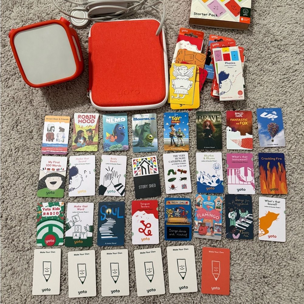 Lot of yoto player, sleeve, yoto card storage and 30 cards